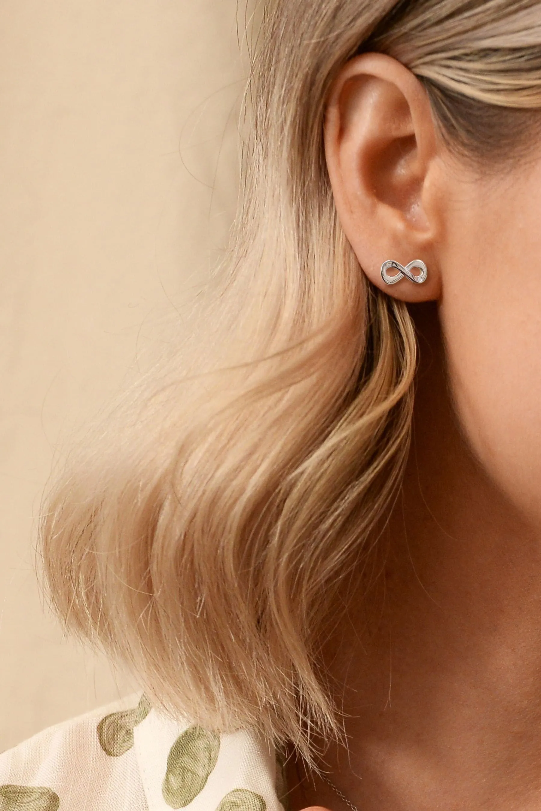 Hot Diamonds Argento - Orecchini con simbolo dell'infinito e amuleti
